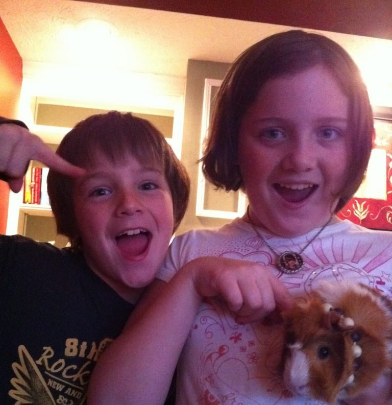 George and Mary Claire with a Guinea Pig