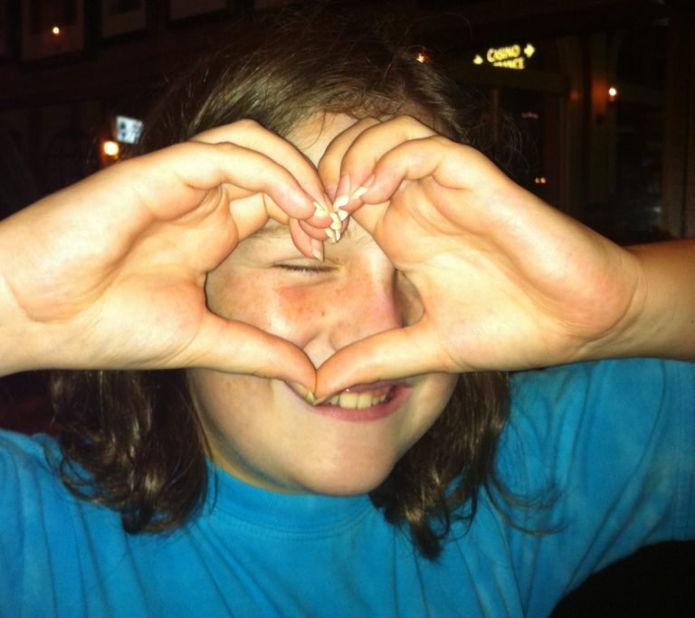 Mary Clair Making a Heart with Her Hands