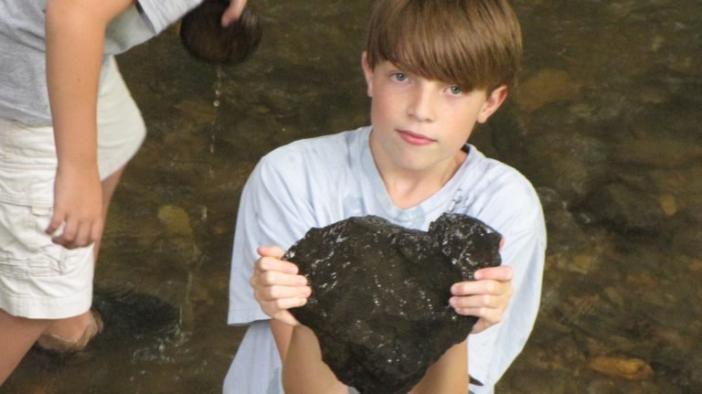 Gus Holding a Heart-Shaped Rock